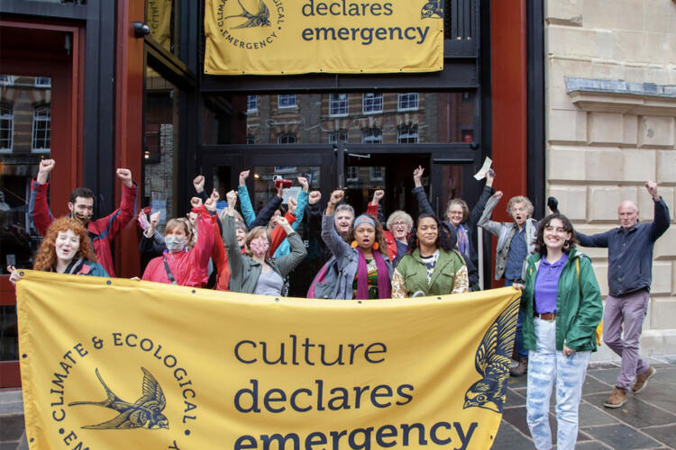 crowd holding Culture Declares Emergency banners