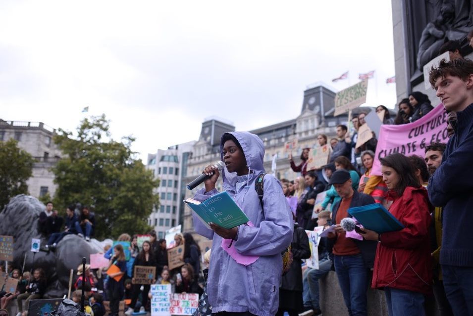 Girl reads letter at London Protest