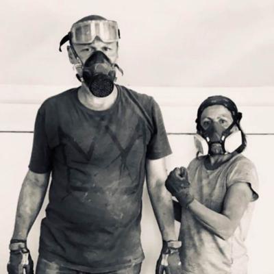 two people in work masks