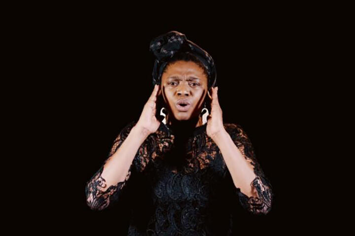woman performing in black