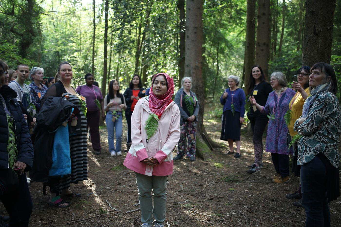 women gather in a forest